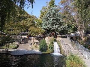 a river with a waterfall in a park at ANATOLI Waterfalls Retreat in Edessa