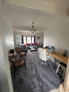 a living room with a couch and a table at Large King Suite Completely Private Space Stay close enough to Newport without the Noise in Portsmouth