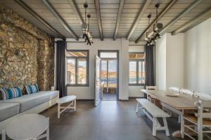 a living room with a couch and a table at Rada Residence in Livadi