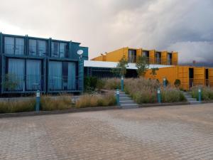 a group of buildings on a brick street at Oxygen Village in Zeïda