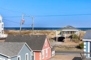 a group of houses with the ocean in the background at 5066 - McBride's Shore Thing 2 in Kill Devil Hills