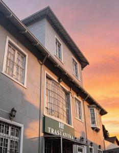 a building with a sign on the side of it at Hotel Traslaviña in Viña del Mar