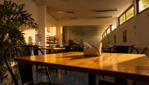 a wooden table with a napkin on top of it at Hotel Traslaviña in Viña del Mar +27 photos