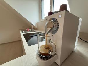 a blender sitting on a counter in a kitchen at Donau Vibes Luxury Family near City and Highway in Linz