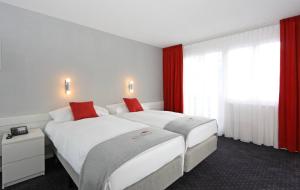 Postel nebo postele na pokoji v ubytování Hotel Steinmattli
