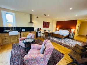 a bedroom with a bed and a living room at Black Isle Bar Apartment in Fort William