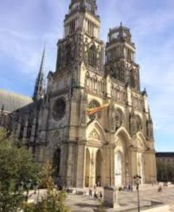 a large building with two towers on top of it at Le Petit Cocon d'Orléans in Orléans