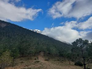 a dirt road in the middle of a mountain at imlil in Imlil +2 photos