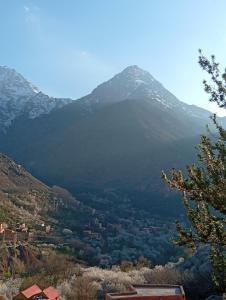 a view of a mountain with a town in the foreground at imlil in Imlil