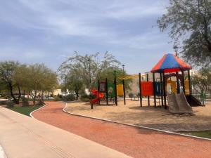 a park with a playground with a slide at Private Apartment in Prague Poniente Area in Hermosillo