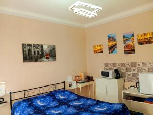 a bedroom with a blue bed in a room at Eros casa in Milan