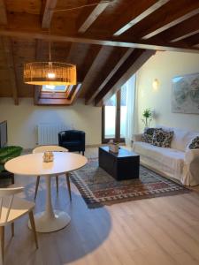 a living room with a couch and a table at La plaza de llanes, Plaza Parres Sobrino, 6 in Llanes