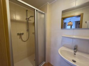 a bathroom with a shower and a sink at Ley Hotel in Klotten +33 photos