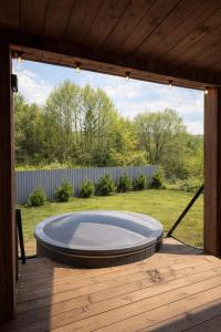 a large open patio with a trampoline in the grass at Nest house in Skole +2 photos