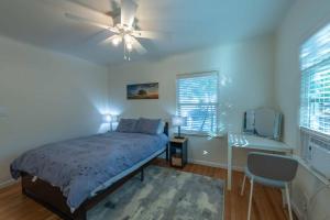 a bedroom with a bed and a ceiling fan at Park Street Pad in Paso Robles