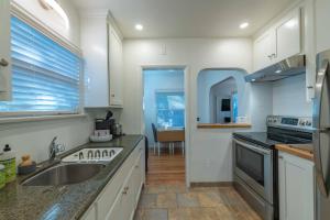 a kitchen with a sink and a stove at Park Street Pad in Paso Robles