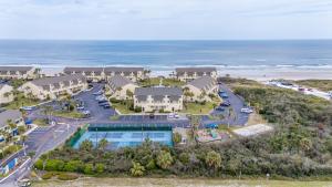 an aerial view of a resort with a pool and the ocean at St Augustine Beachfront Condo with Ocean Views in Saint Augustine Beach