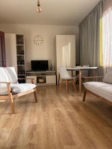 a living room with a table and a couch at TREFOIL in Lori Berd +43 photos