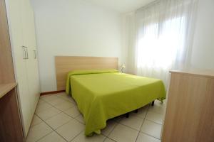 Un pat sau paturi într-o cameră la Residence Sole del Conero