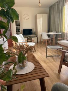 a living room with a table and chairs at TREFOIL in Lori Berd