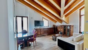 a living room with a table and a couch at Casa Stelvio in Turchi