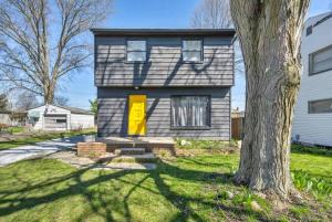 a house with a yellow door and a tree at 113 Madison Ave, Cuyahoga Falls in Cuyahoga Falls +18 photos