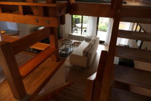 an overhead view of a living room with a couch and stairs at Ferienwohnung EGS in Lahr