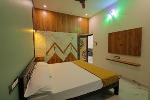 a bedroom with a bed in a room at MK service apartment in Tirunelveli
