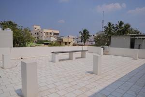 a bench sitting on top of a patio at MK service apartment in Tirunelveli