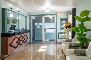a lobby with a waiting room with a reception desk at Attleboro Motor Inn in South Attleboro