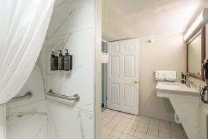 a bathroom with a shower and a sink at Attleboro Motor Inn in South Attleboro +47 photos