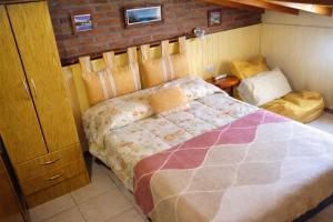 a bedroom with a bed in a room at Cabaña LOW COST in El Bolsón