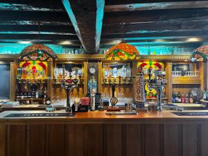 a bar with a wooden counter top and a barraged at Sams Wine Bar Harwich ltd in Harwich