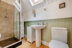 a bathroom with a toilet and a sink and a shower at 3 Bed in Little Petherick oc-maplod in Little Petherick +27 photos