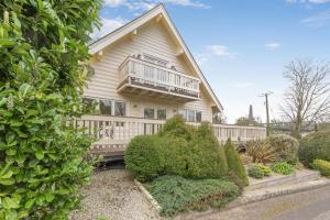 a house with a balcony on the side of it at 3 Bed in Little Petherick oc-maplod in Little Petherick