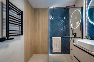 a bathroom with a shower and a sink at Apartamenty Centrum 50 m od Rynku, FREE PARKING in Nowy Targ +73 photos