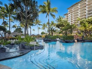 a pool at the resort with palm trees at Hyatt Vacation Club at Ka'anapali Beach in Lahaina