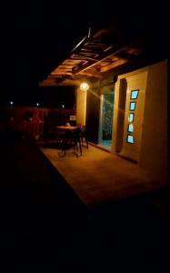 a dark room with a table and a window at night at Guest House Nadol SUP and Bikes included in Ohrid +21 photos