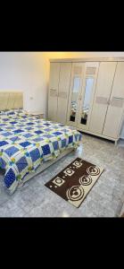 a bedroom with a bed with a sign on the floor at Appartement 2 chambre in Gabès