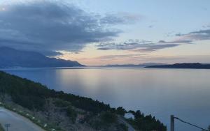 a view of a large body of water at sunset at Mimice Hills Luxury Penthouse 229 m2, Panoramic Wrap Terrace, Jacuzzi,BBQ in Mimice