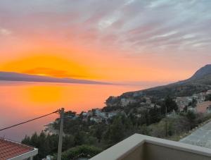 a view of the ocean at sunset at Mimice Hills Luxury Penthouse 229 m2, Panoramic Wrap Terrace, Jacuzzi,BBQ in Mimice