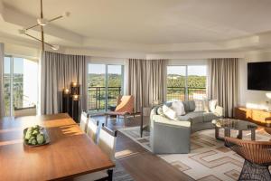 a living room with a couch and a table at Signia by Hilton La Cantera Resort & Spa in San Antonio