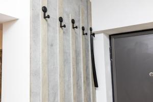 a door with black handles next to a building at Old Town Luxury 1 in Târgovişte +57 photos