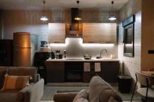 a kitchen with a sink and a stove at Casa Deitania I in Caravaca de la Cruz +14 photos