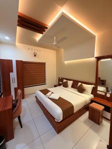 a bedroom with a large bed in a room at Diga Vista Lake View 4BHK Swimming Pool Cottage Munnar in Munnar +112 photos