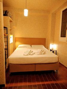 a bedroom with a bed with two towels on it at Due balconcini sul mare in Santa Margherita Ligure