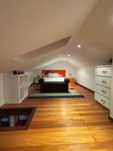 a bedroom with a bed in a attic at Area 3B in Camariñas