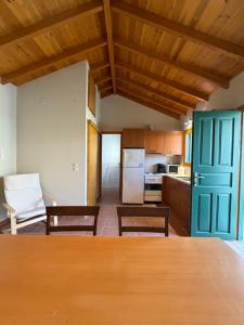 a kitchen with a table and chairs in a room at Apollon Heritage House in Palaiókipos +27 photos