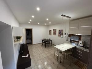 a kitchen and dining room with a table and chairs at Boffi house in Sezze