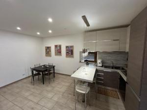 a kitchen with a table and a dining room at Boffi house in Sezze